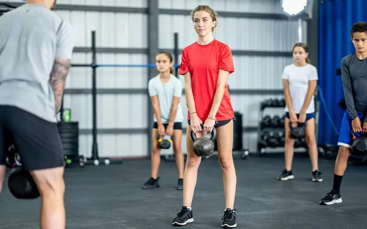 Stronger, Smarter, Not Broken: How Fastpitch Softball Players Can Incorporate Strength Training Without Burning Out